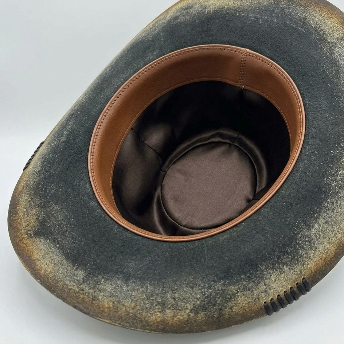 Aged Black Cowboy Hat with Patterned Band and Side Stitching