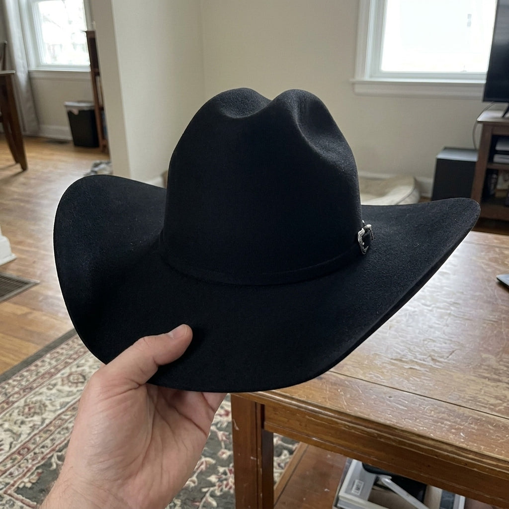 Black Felt Cowboy Hat with Deep Pinched Crease and Upturned Brim