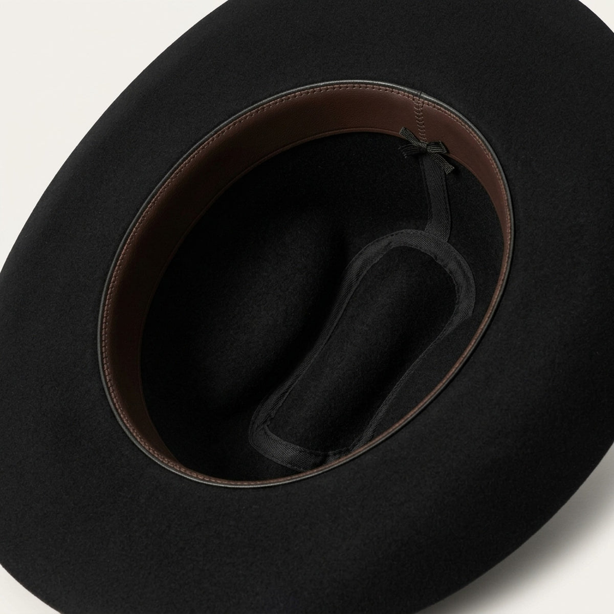 Black Felt Cowboy Hat with Tall Pinched Crown and Upturned Brim