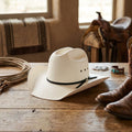 White Straw Cowboy Hat with Pinched Crown and Black Tie Band
