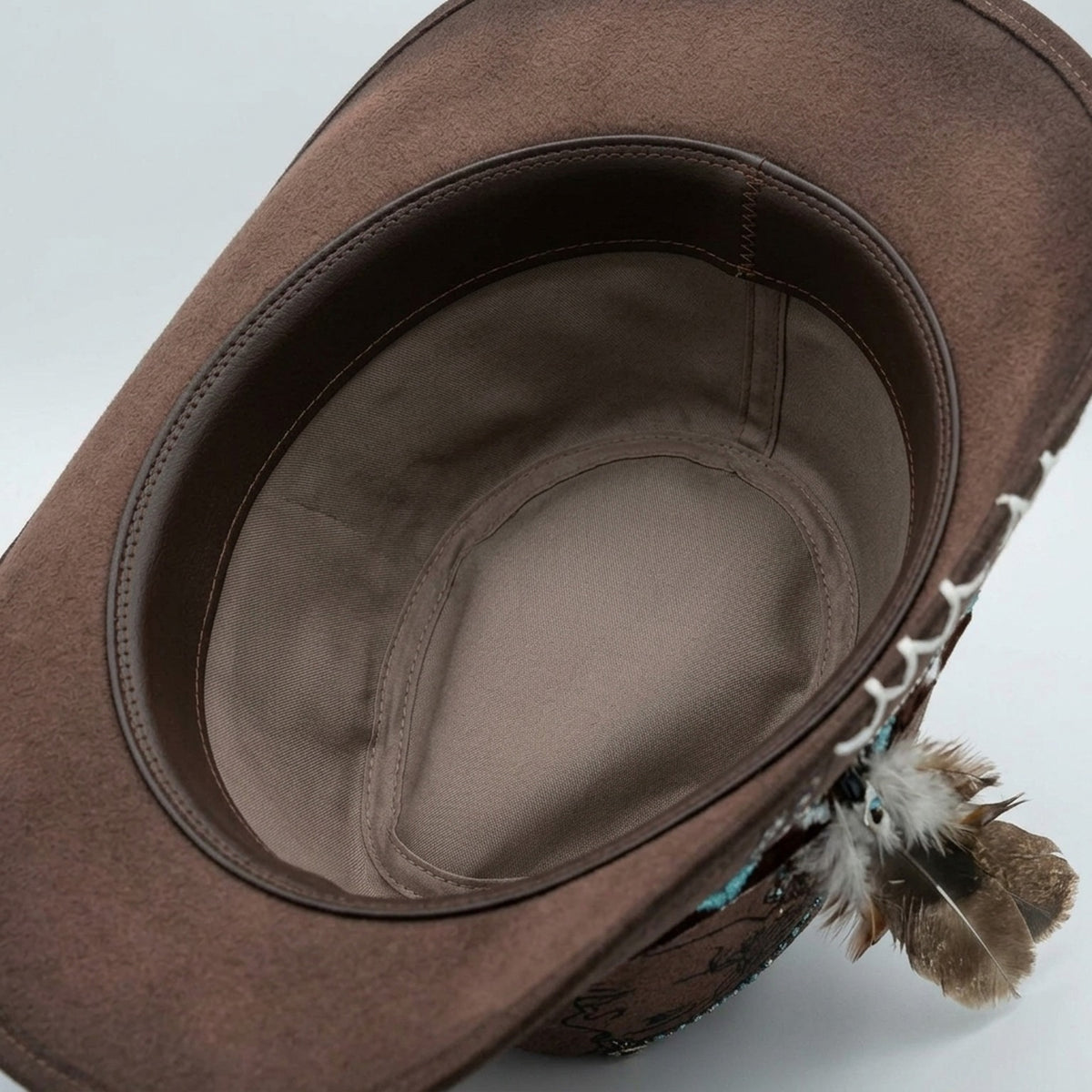 Brown Cowboy Hat with Portrait Etching and Beaded Feather Band