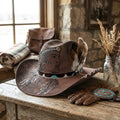 Brown Cowboy Hat with Portrait Etching and Beaded Feather Band